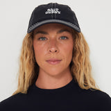 Person wearing a black dad nylon cap with 'Salt Gyspy' logo against a white background